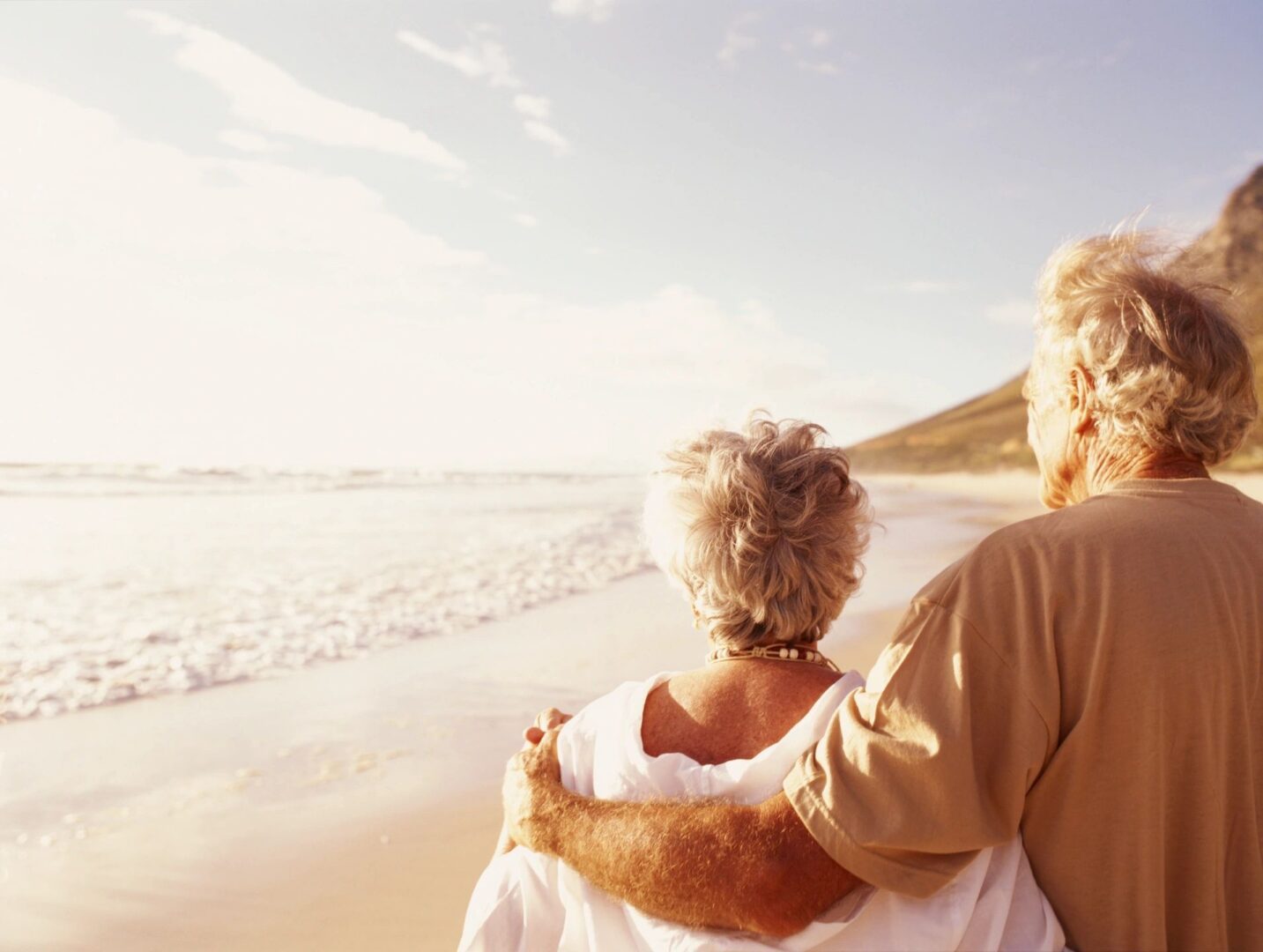 Romantic beach moment for older couple