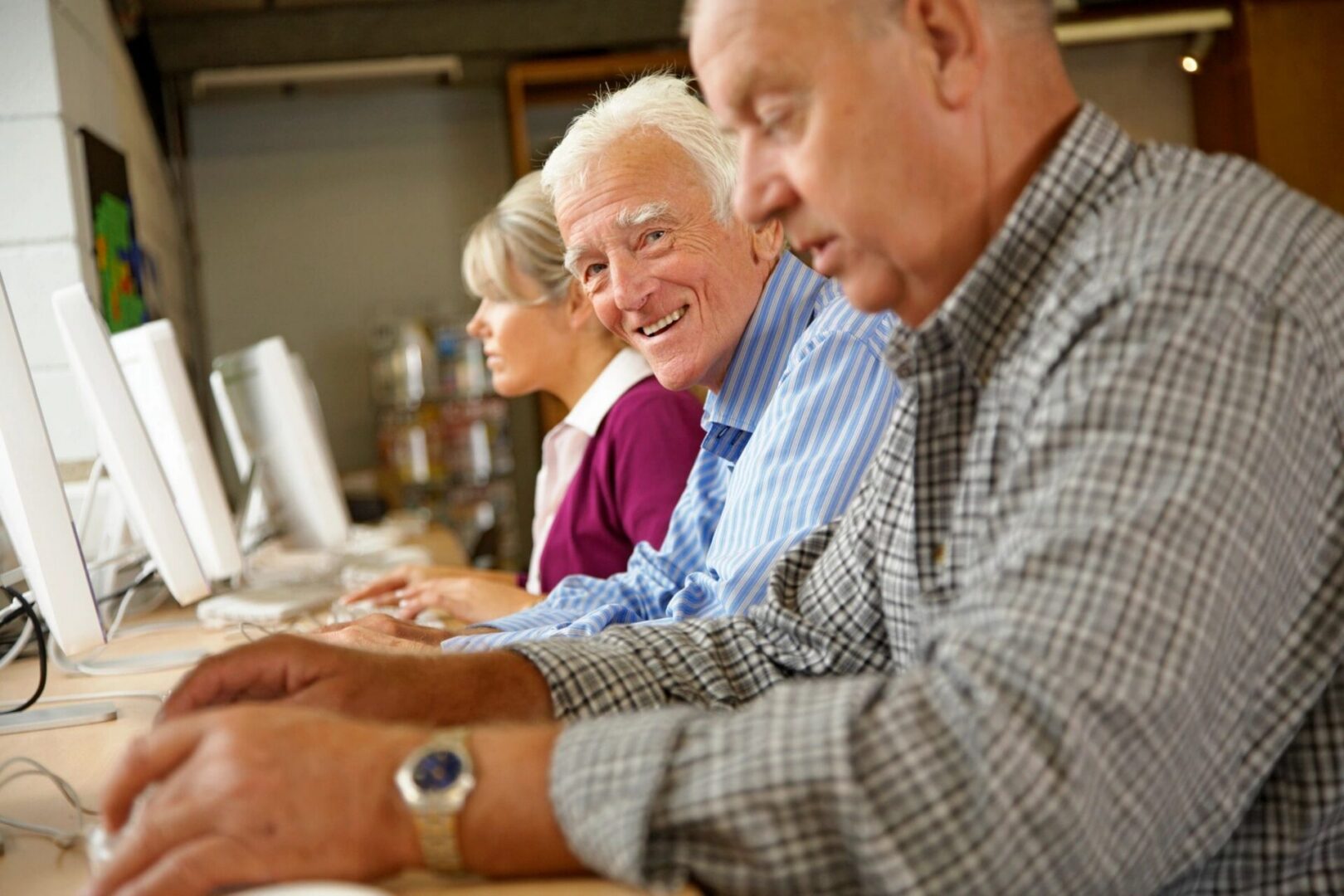 Group of seniors at computer training