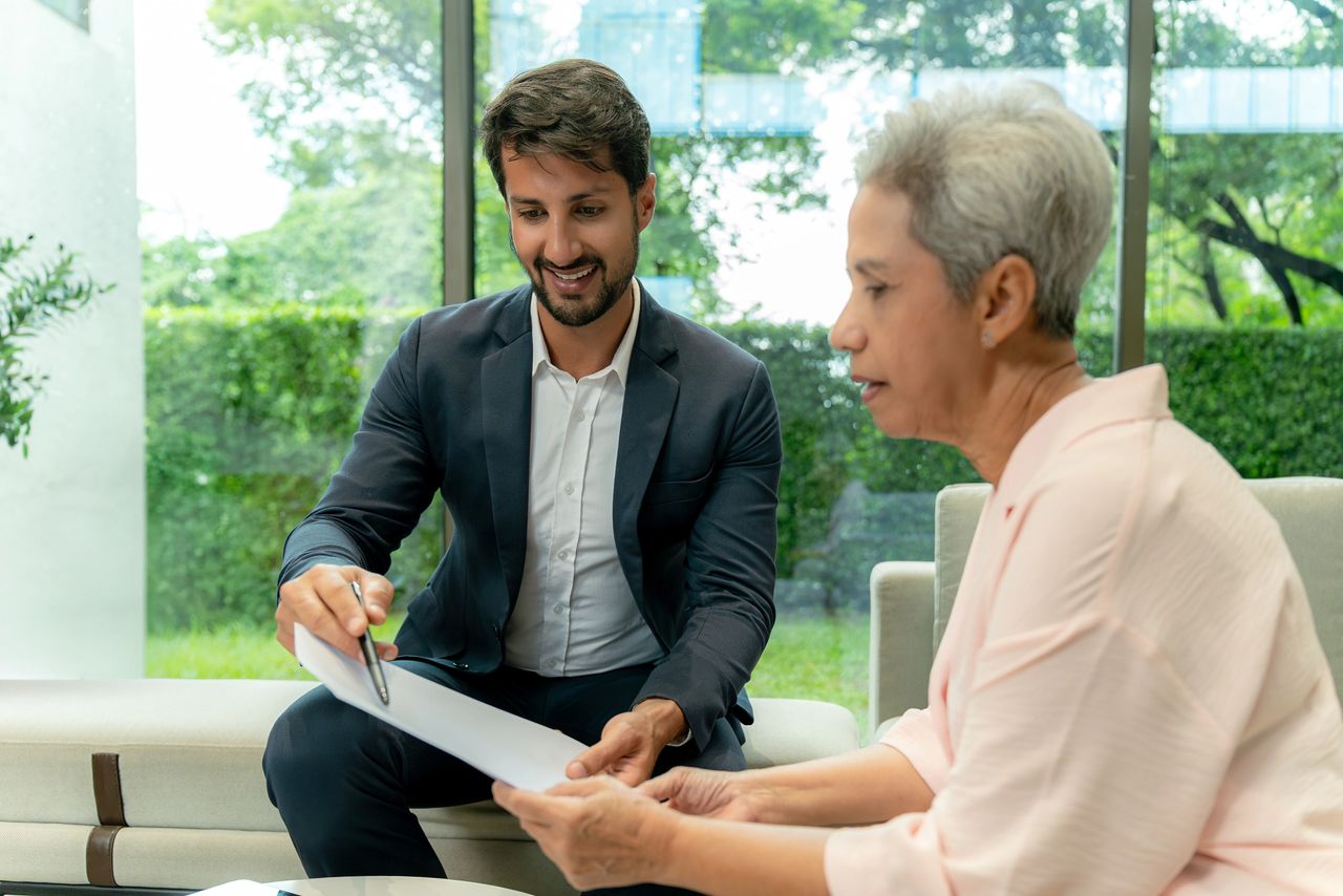 Two colleagues reviewing paperwork